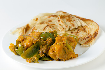 Image showing Aloo capsicum curry and paratha side view