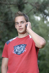 Image showing Young man talking on phone