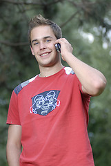 Image showing Young man talking on phone