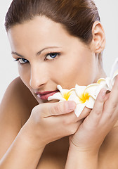 Image showing Beautiful woman holding flowers