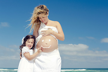 Image showing Making a smile on mom's belly