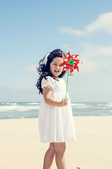 Image showing Little girl with a windmill