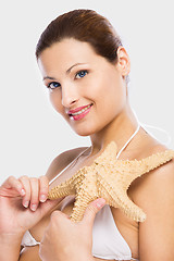 Image showing Beautiful woman holding a starfish