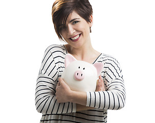 Image showing Woman with a piggybank