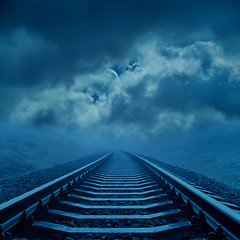 Image showing railroad to cloudy horizon in night