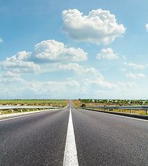 Image showing asphalt road and clouds over it