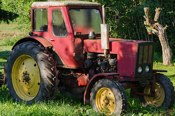 Image showing rural red old farm tractor outdoor 