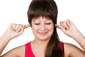 Image showing young beautiful woman covering her ears. isolated