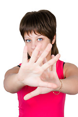 Image showing young beautiful girl hiding behind her hands. isolated