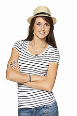 Image showing Smiling young woman in stripped tshirt and straw hat