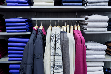 Image showing Clothing on hangers in shop