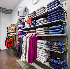 Image showing Clothing on hangers in shop