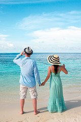 Image showing Vacation Couple walking on tropical beach Maldives.