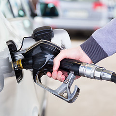 Image showing Petrol being pumped into a motor vehicle car.