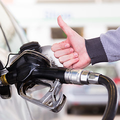 Image showing Petrol being pumped into a motor vehicle car.