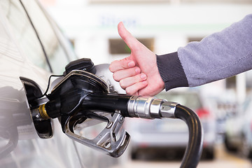 Image showing Petrol being pumped into a motor vehicle car.