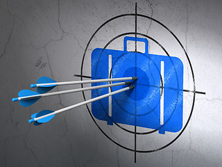 Image showing Vacation concept: arrows in Bag target on wall background