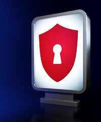 Image showing Safety concept: Shield With Keyhole on billboard background