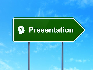 Image showing Advertising concept: Presentation and Head With Light Bulb on road sign background