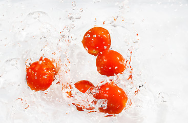 Image showing red cherry tomatoes with water splash