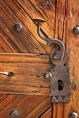 Image showing ancient latch on beautiful wooden door