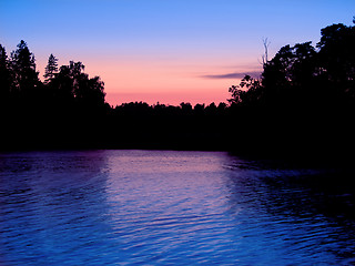 Image showing Sunset over water