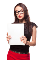 Image showing Office girl holding empty paper blank template