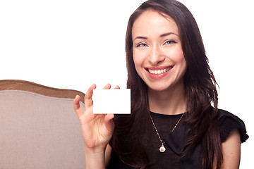 Image showing Smiling young woman holding blank businesscard