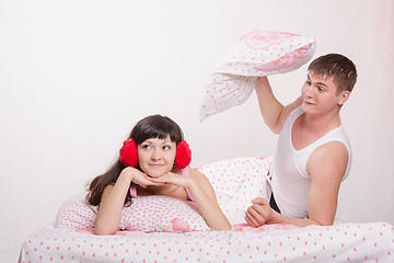 Image showing Man in a quarrel Woman ready to hit the pillow