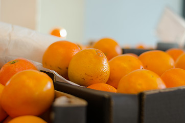 Image showing close up of orange orange in box 