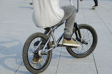 Image showing guy with sports clothing sit on sports BMX bicycle 