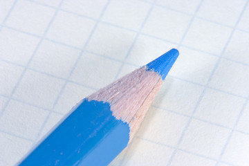 Image showing Blue pencil on notepad