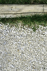 Image showing Green grass and stones