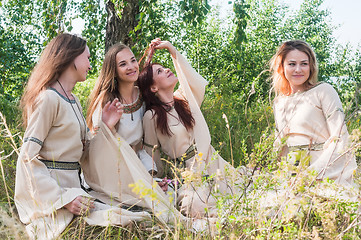 Image showing Beautiful women relaxing over nature background