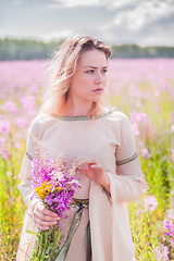 Image showing Beautiful sad girl on meadow