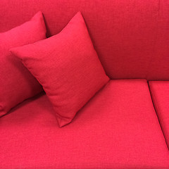 Image showing Pink sofa with cushions