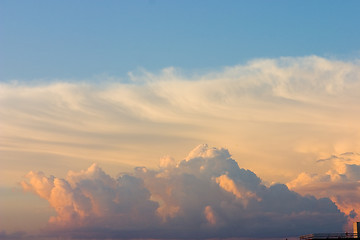 Image showing red, yellow and orange clouds on blue sky