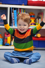 Image showing Successful 2 years old boy winning using a digital tablet comput