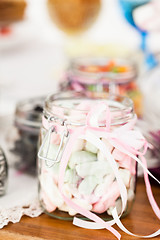 Image showing Pastel colored marshmallows in jar