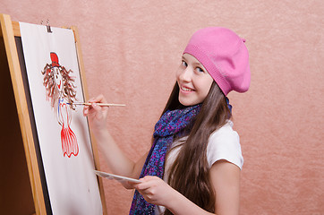 Image showing Schoolgirl drawing at a lesson