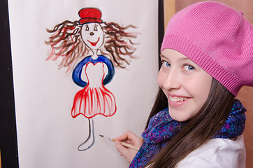 Image showing Girl artist draws a funny girl