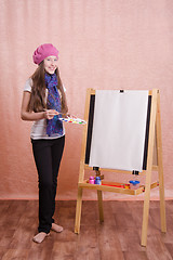 Image showing The girl in image of  artist at easel