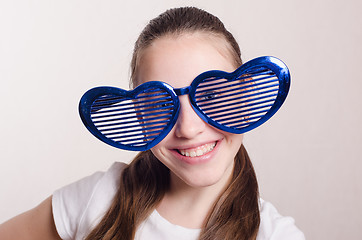 Image showing Smiling girl in the big funny glasses