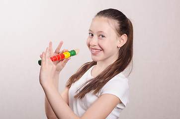 Image showing Teenage girl playing the flute