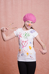 Image showing Painter girl in a decorated shirt