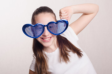 Image showing Twelve year old girl with big glasses in shape heart