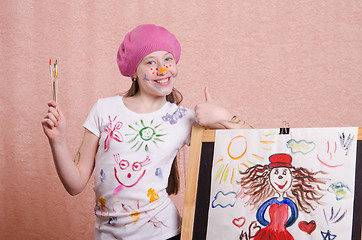 Image showing The girl drew a picture and shows class