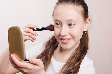 Image showing Girl twelve years with pleasure face powders