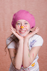 Image showing Portrait of a girl covered in paint