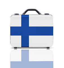 Image showing Business suitcase for travel with reflection and flag of Finland